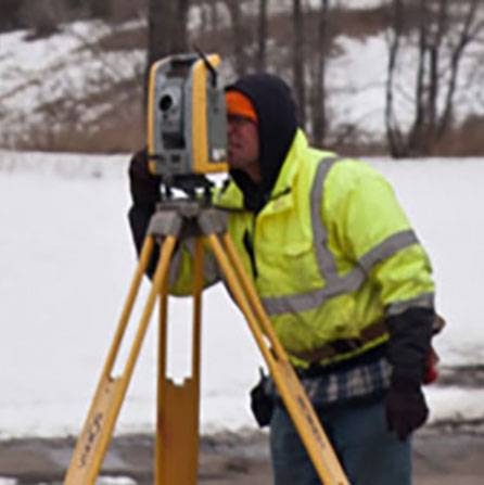 Man surveying in winter