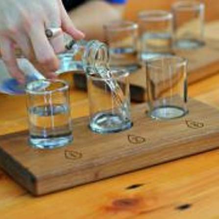 Person pouring water into glasses