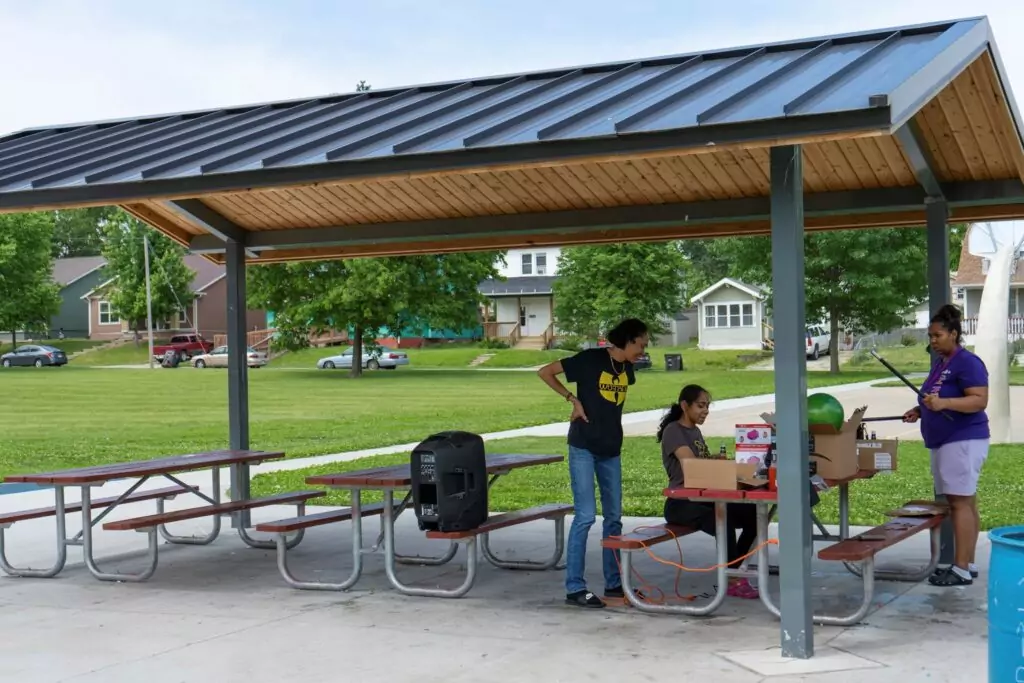 Community members using the new shelter at Bates Park