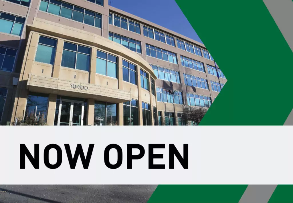 • Front of a building in Eden Prairie, Minnesota with “Now Open” text in front of photo