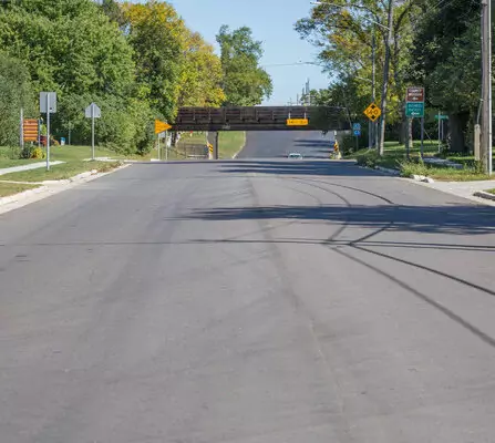 Newly paved road with a bridge in the distance