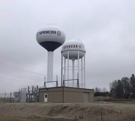 Two water storage towers with a utility building below