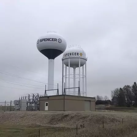 Two water storage towers with a utility building below
