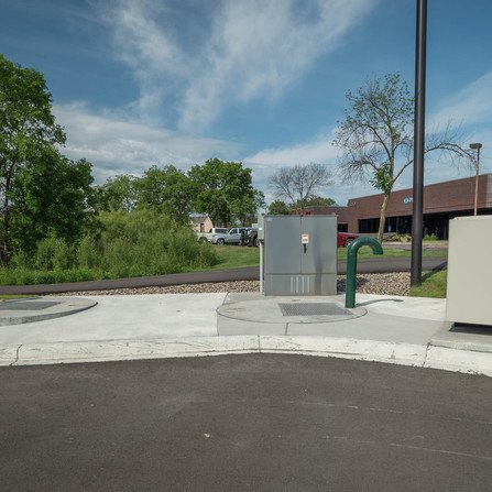 Sewer pipes and utility boxes seen outside a building