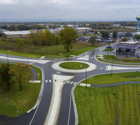 Aerial view of a roundabout near a gas station