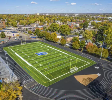 Birds eye view of a sports complex; equipped with track, soccer, and football field