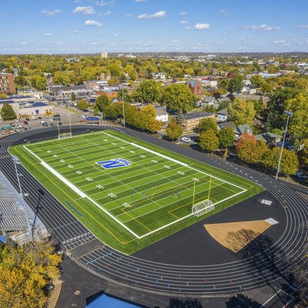 Birds eye view of a sports complex; equipped with track, soccer, and football field