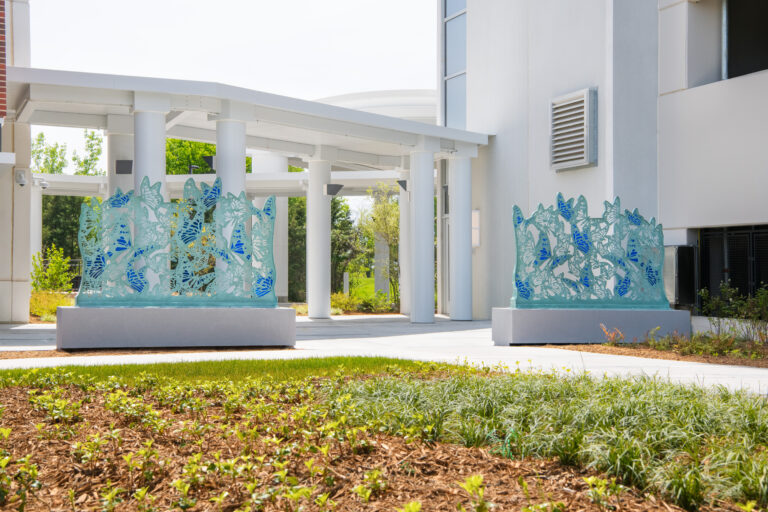 Atrium Health Pineville healing garden light and dark blue butterfly sculpture daytime