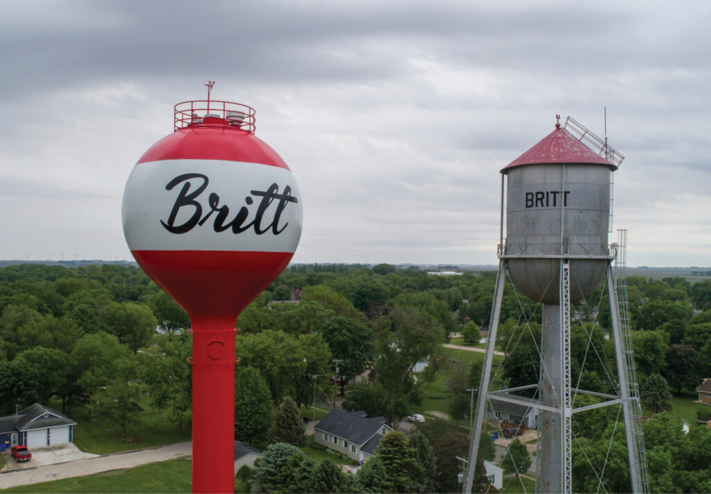 Side by side of the City of Britt’s old and new water towers
