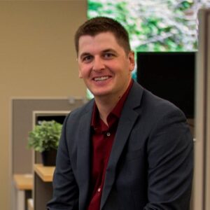 man smiling at camera in suit