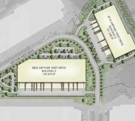 Site map showing two large buildings labeled 870 Air Park West Drive and 8805 Air Park West Drive surrounded by roads and parking areas. The surrounding landscape includes trees and grass.