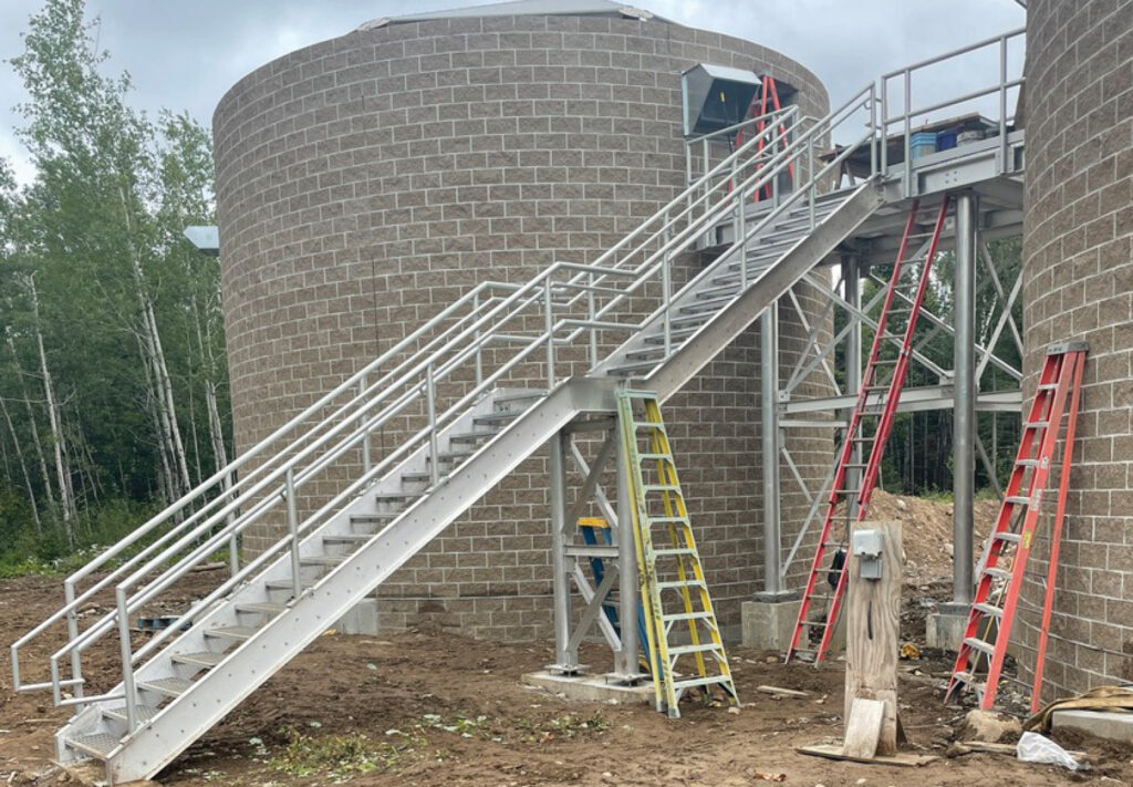 Hoyt Lakes WWTF construction with ladders stacked next to it