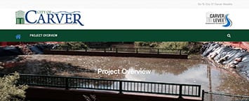 Screenshot of a webpage from the City of Carver featuring Project Overview on a river scene. The image beautifully captures a bridge and waterfall, highlighting ongoing public projects aimed at enhancing the natural beauty and infrastructure of the area.