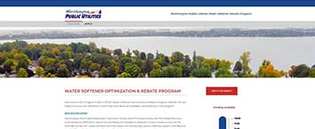 Screenshot of a website showcasing a scenic lake surrounded by trees. Below, details on water softener optimization and rebate program are provided, highlighting public projects. There are sections for application information and a prominent red button.