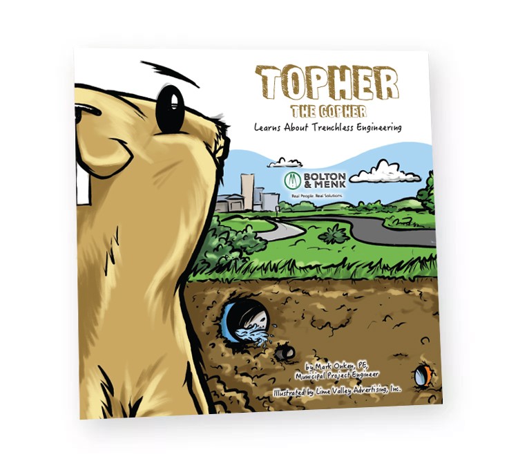 Illustrated book cover titled Topher the Gopher Learns About Trenchless Engineering. Features a gopher peeking out of a tunnel, with a city landscape and clear sky in the background. The book is authored by Mark Onken and illustrated by Lime Valley Advertising.