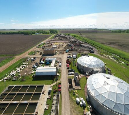 A wastewater treatment facility being constructed in a field