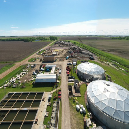 A wastewater treatment facility being constructed in a field