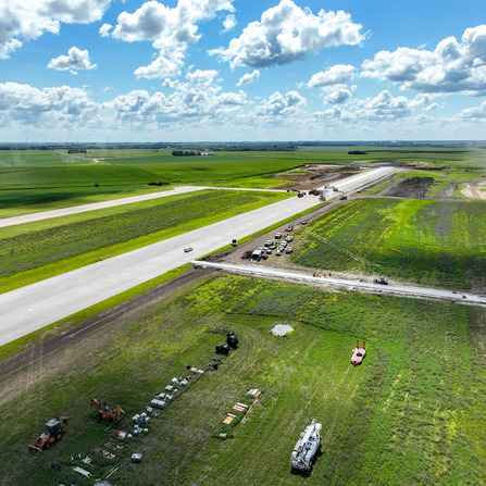 A new runway being constructed with equipment working