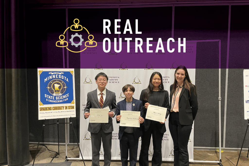 A group of people holding award certificates