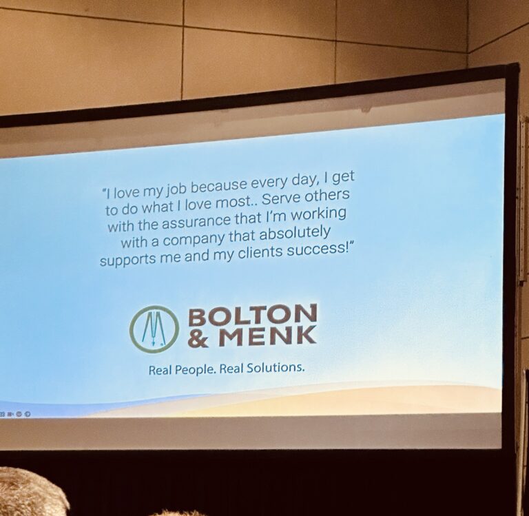 A presentation slide displays a testimonial about job satisfaction and company support, featuring the Bolton & Menk logo and tagline, Real People. Real Solutions.
