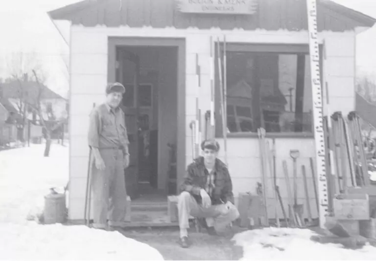 John Bolton and Martin Menk by the entrance of an early office