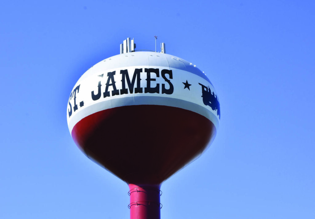 Red, white, and gray water tower