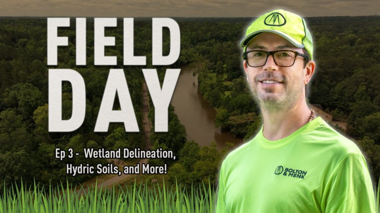 A man in a bright green shirt and cap stands in front of a wooded river landscape. Large text reads Field Day, with smaller text below: Ep 3 - Wetland Delineation, Hydric Soils, and More!.