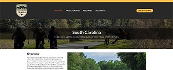 A website page for the South Carolina Trails, featuring cyclists on a trail, a navigation menu, and a section titled Overview with text and a landscape photo of a trail bordered by greenery.