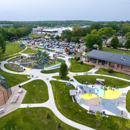 Aerial view of a park with many people and trees