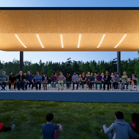 A group of people sitting on a stage outside under a canopy