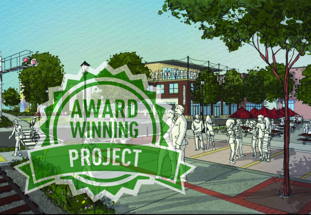 Illustration of a lively urban street scene with people walking and gathering. A large green badge in the foreground reads Award Winning Project. Trees and buildings line the street under a clear sky.