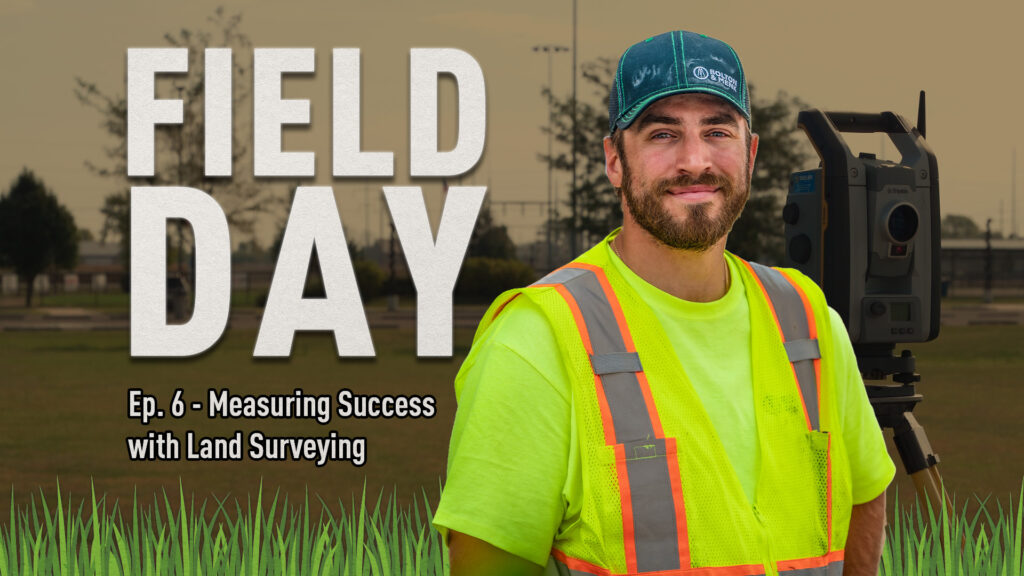 A smiling man in a neon yellow safety vest and teal hat stands beside surveying equipment outdoors. Text reads: FIELD DAY Ep. 6 - Measuring Success with Land Surveying. Grass and trees are in the background.