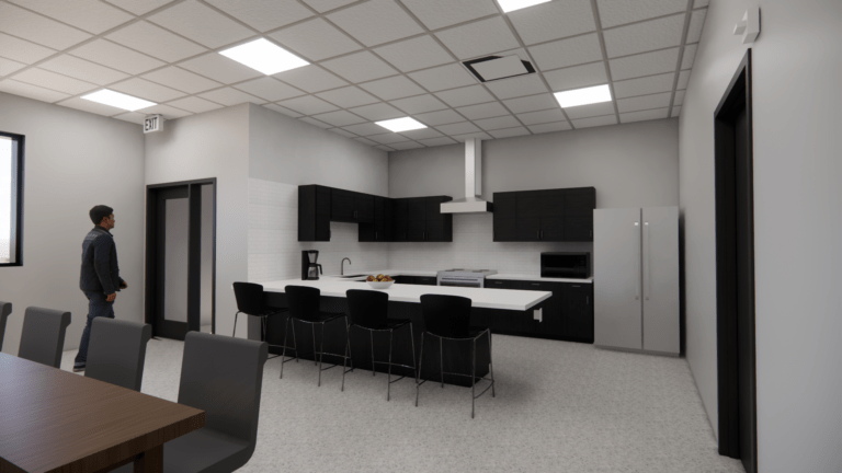 A modern kitchen with black cabinets, a large white island with barstools, stainless steel appliances, and a man standing near the door. The ceiling has recessed lights and there is a large window on the left.