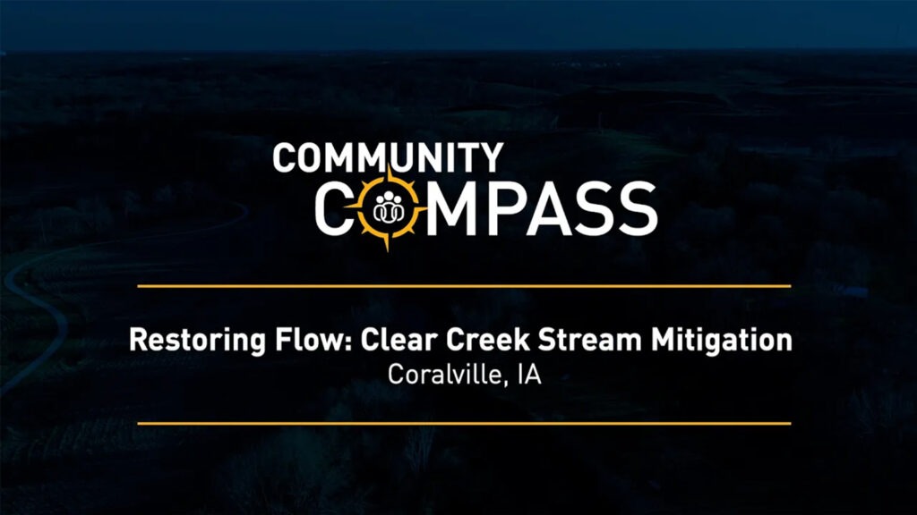 A title card with the Community Compass logo reads, Restoring Flow: Clear Creek Stream Mitigation, Coralville, IA against a dark, aerial landscape background.