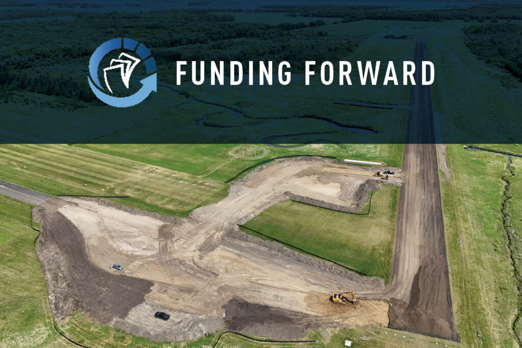 Aerial view of a construction site with earth-moving equipment on grassy land. At the top, a translucent banner reads Funding Forward with a stylized logo of a bird in a circle.