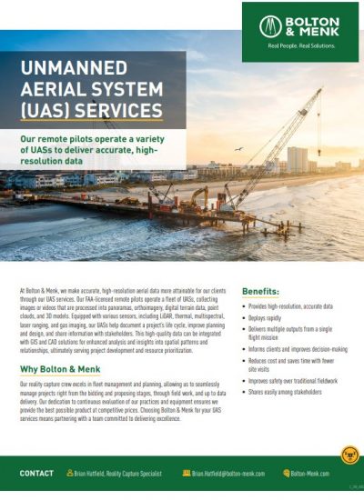 A construction site near water with a crane, barge, and truck under a clear sky. Text highlights Bolton & Menk’s UAS Services, showcasing their benefits for efficient project monitoring and includes contact information.